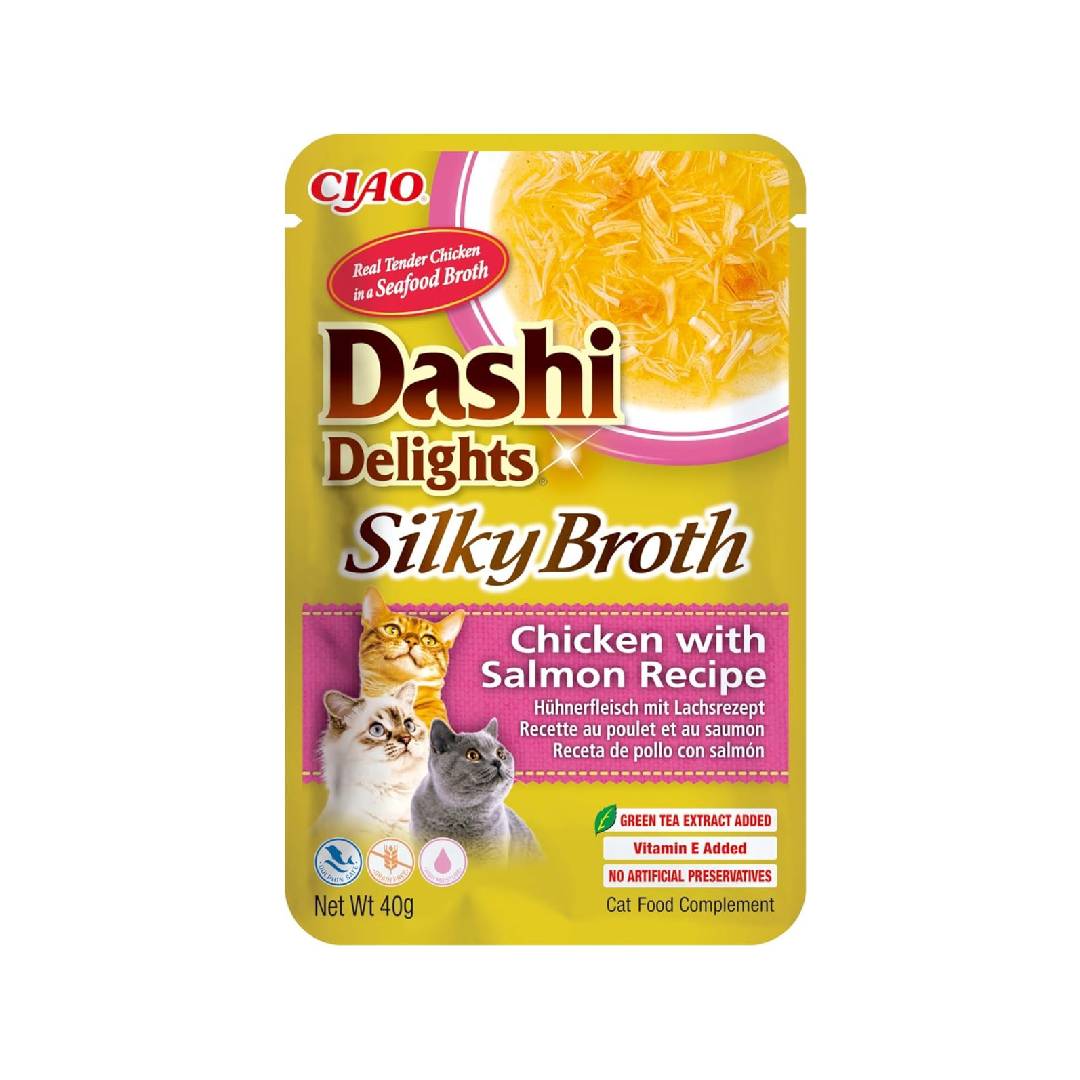 Cat food pouch labeled 'Dashi Delights Silky Broth' with chicken and salmon recipe on a white background.