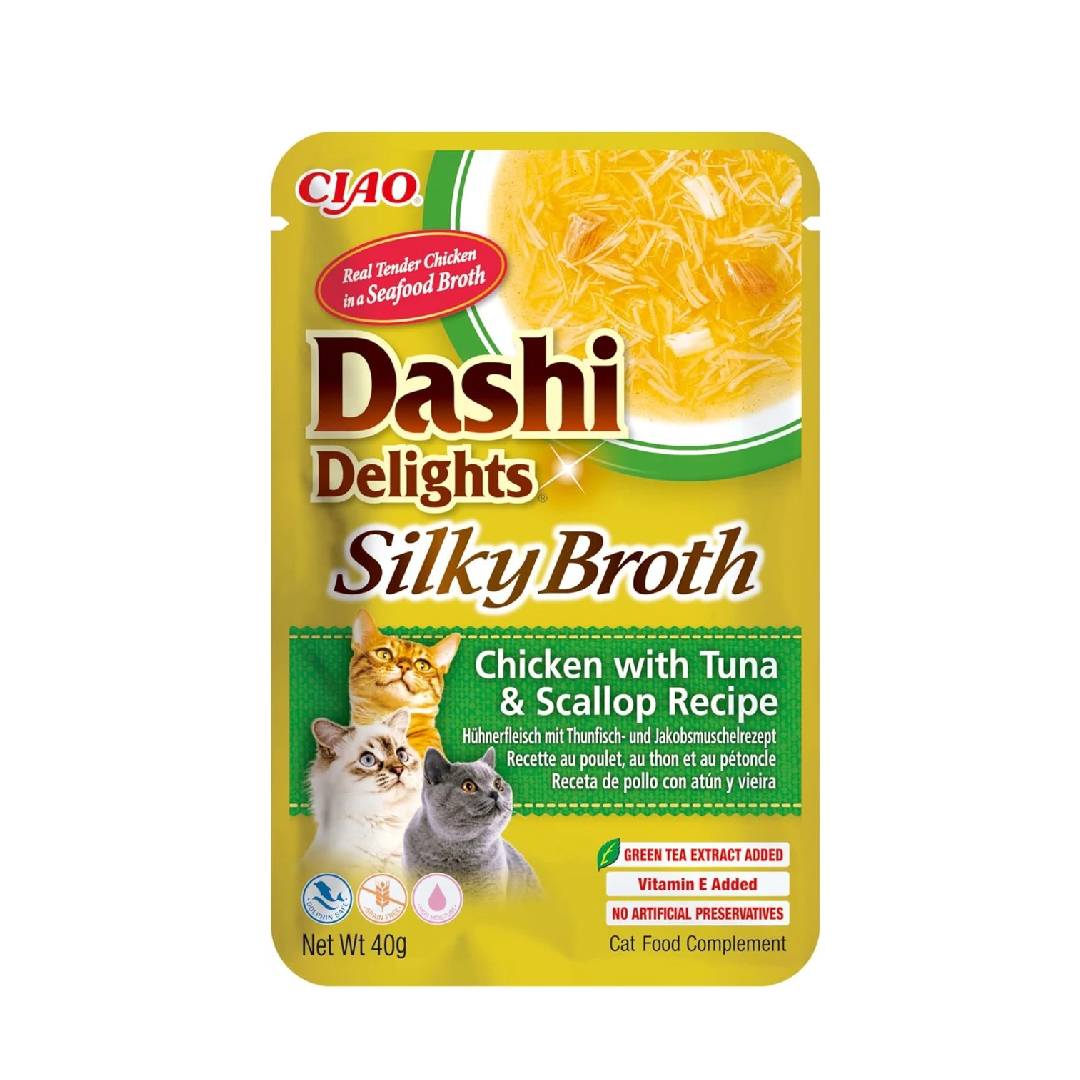 Cat food pouch labeled 'Dashi Delights Silky Broth' with chicken, tuna, and scallop recipe on a white background.