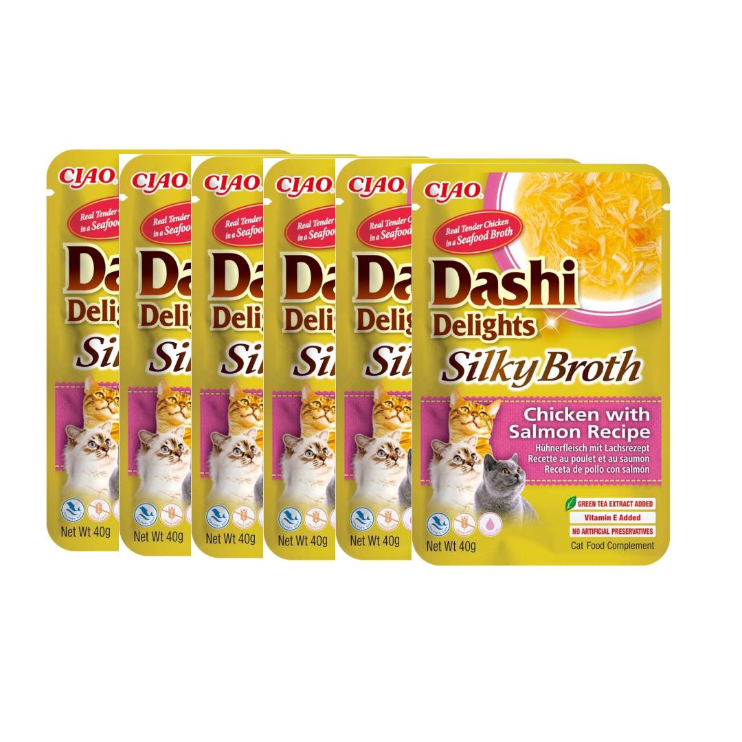 Multiple packages of Dashi Delights Silky Broth cat food on a white background