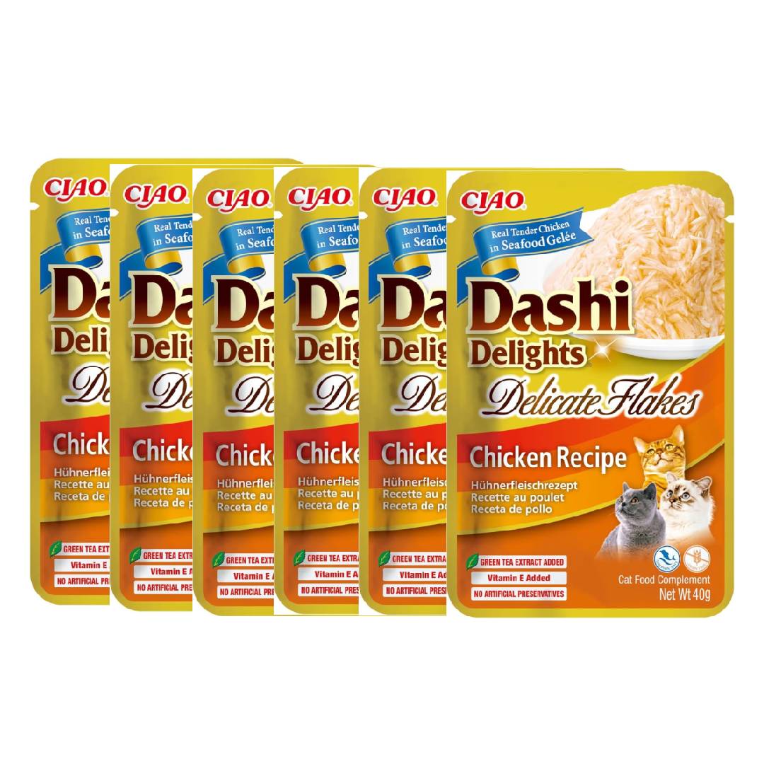 Multiple packages of Dashi Delights cat food on a white background