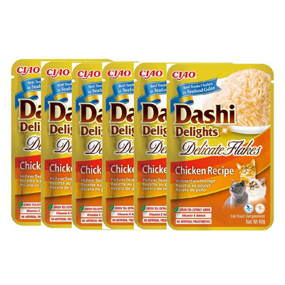 Multiple packages of Dashi Delights cat food on a white background