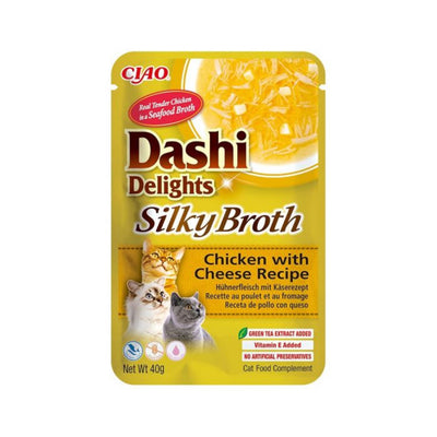 Cat food pouch labeled 'Dashi Delights Silky Broth' with chicken and cheese recipe on a white background.